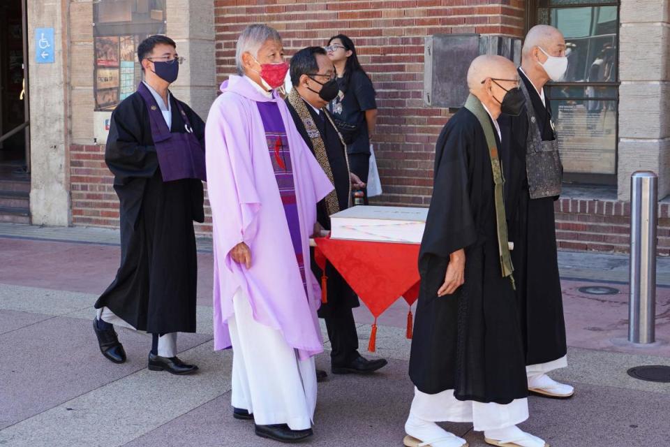 Procession clergy carrying the Ireicho book
